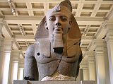 British Museum Top 20 02-2 Colossal Bust of Ramesses II 2. Ramesses II bust � Thebes, 1250BC, 267cm high. This fragment of the statue of Ramesses II (1279-1213 BC) was cut from a single block of two-coloured granite. The sculptor has used a slight variation of normal conventions to relate his work to the viewer, angling the eyes down slightly, so that the statue relates more to those looking at it. He is shown wearing the nemes head-dress surmounted by a cobra diadem. It was retrieved from the mortuary temple of Ramesses at Thebes in 1816.